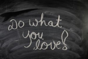 Do what you love! written on a black chalkboard